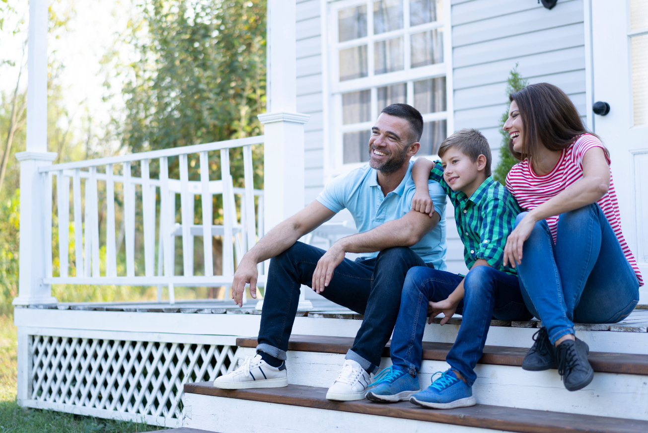 family sitting on new porch built with heloc funds
